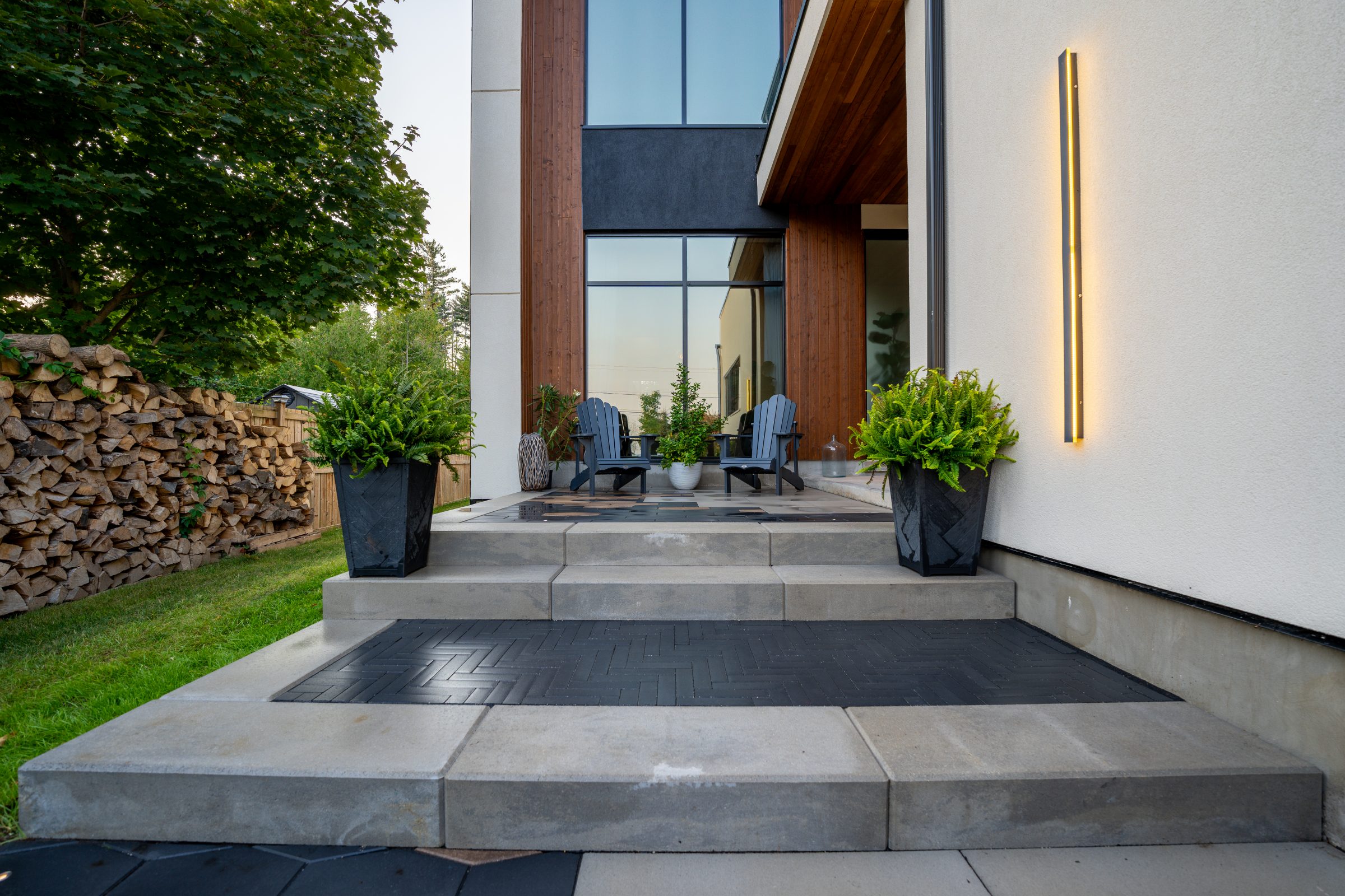 Modern patio with chairs and potted plants