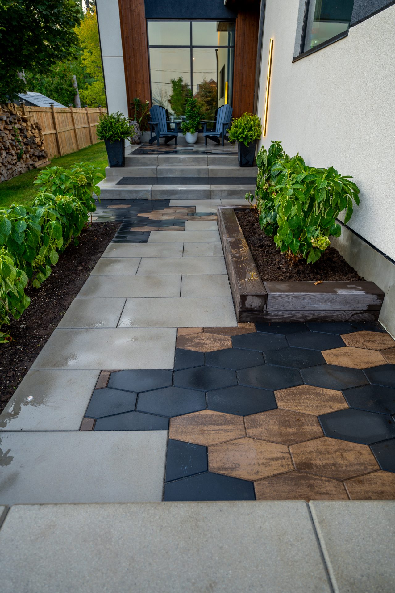 Modern patio with geometric tiles and greenery