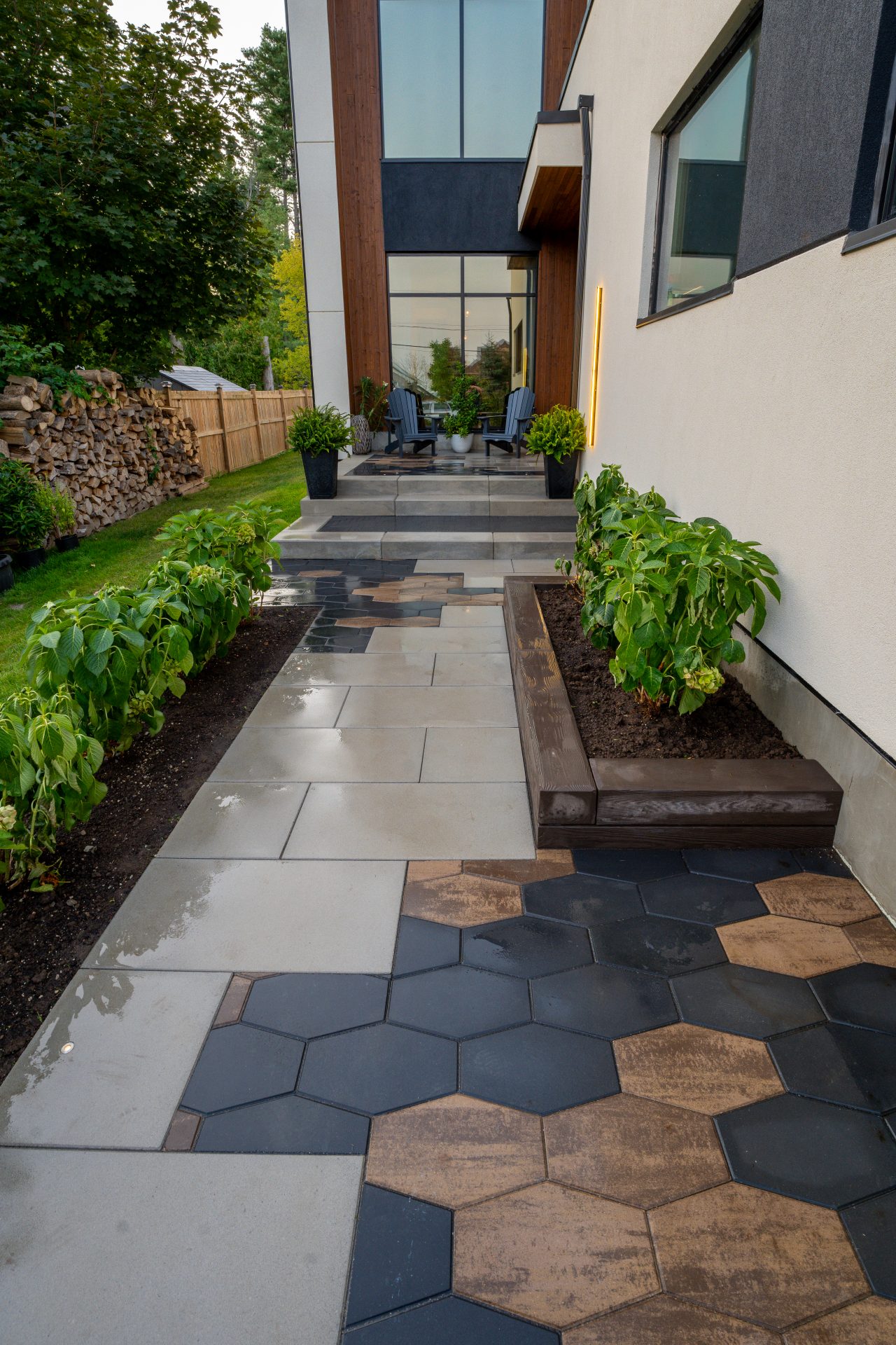 Modern house entrance with patio and plants