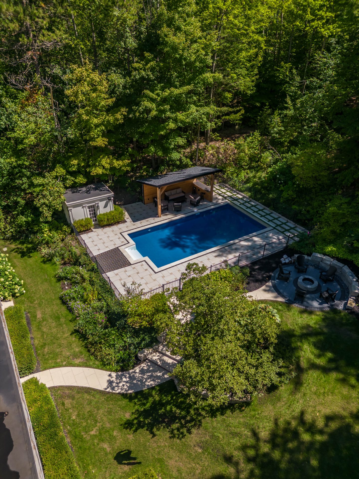 Aerial view of backyard pool and patio area.
