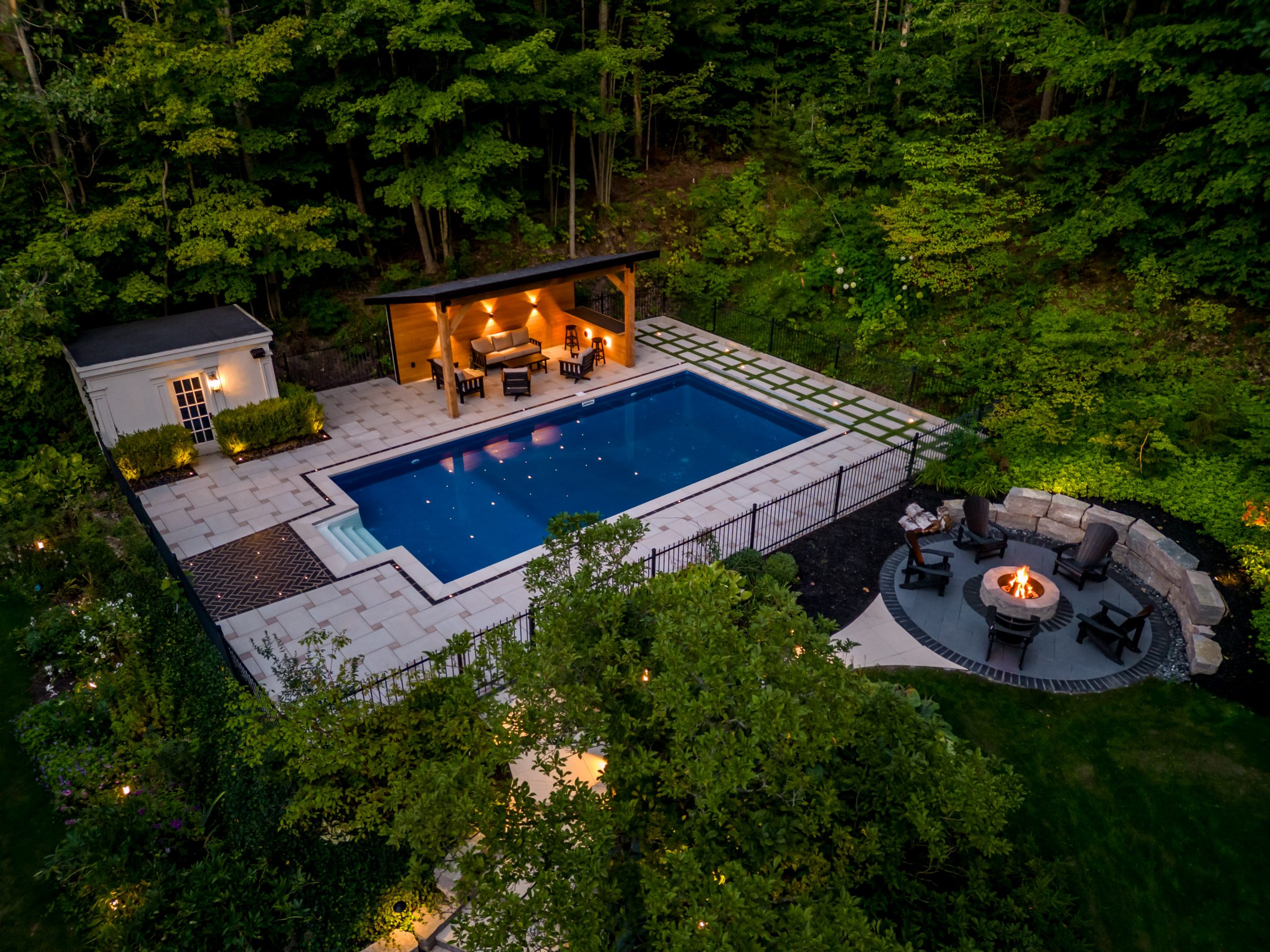 Aerial view of luxury pool and fire pit.