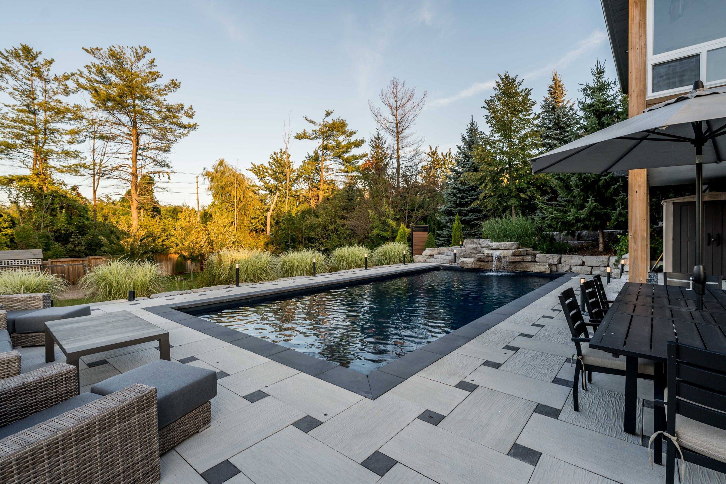 Modern backyard with pool and patio furniture