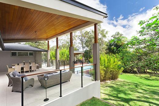 Modern patio with outdoor seating and garden view.