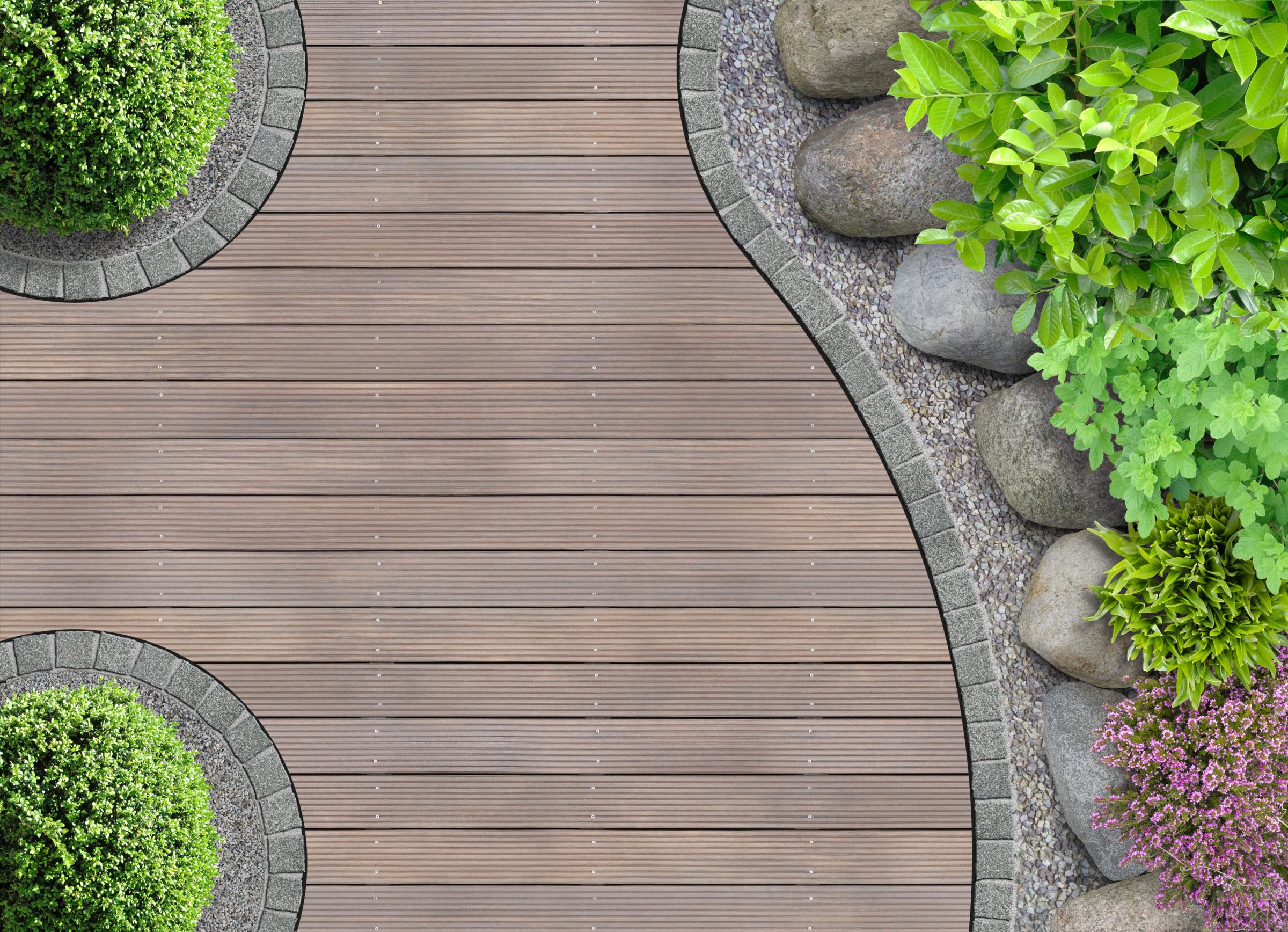 Curved wooden deck with surrounding green plants