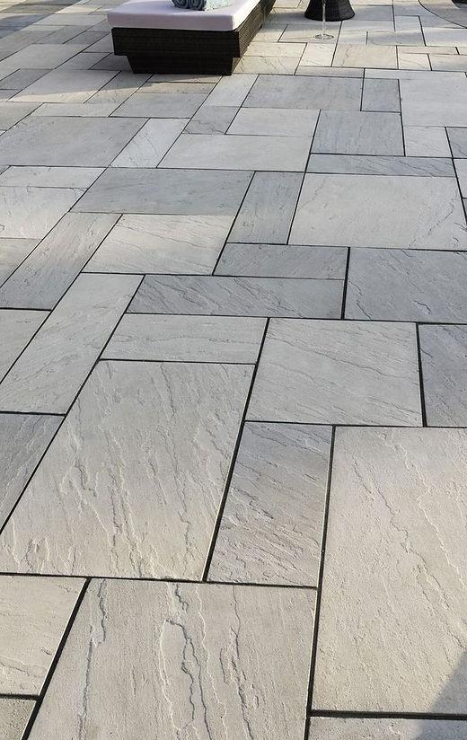 Gray stone tiles in herringbone pattern