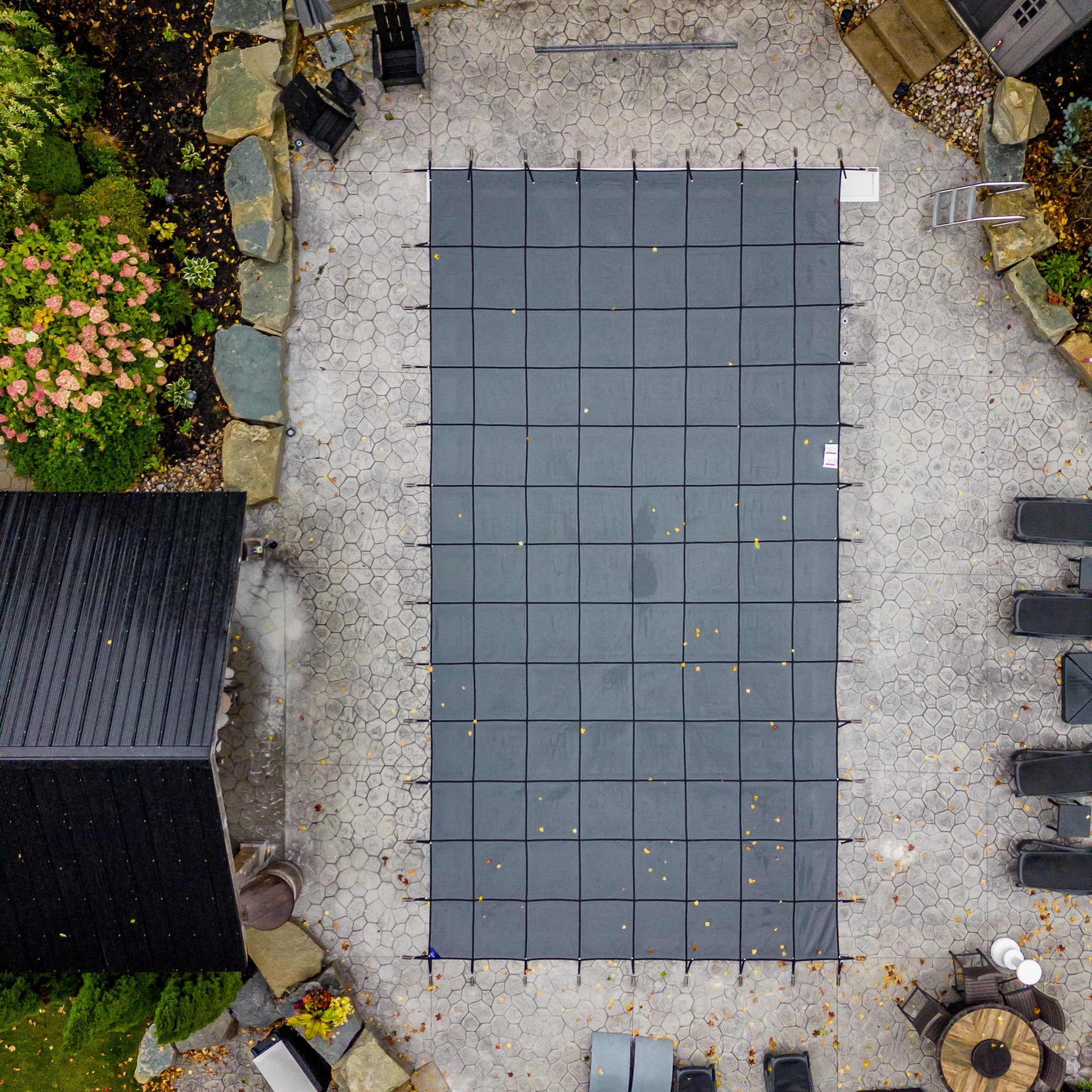 Overhead view of patio with covered pool.